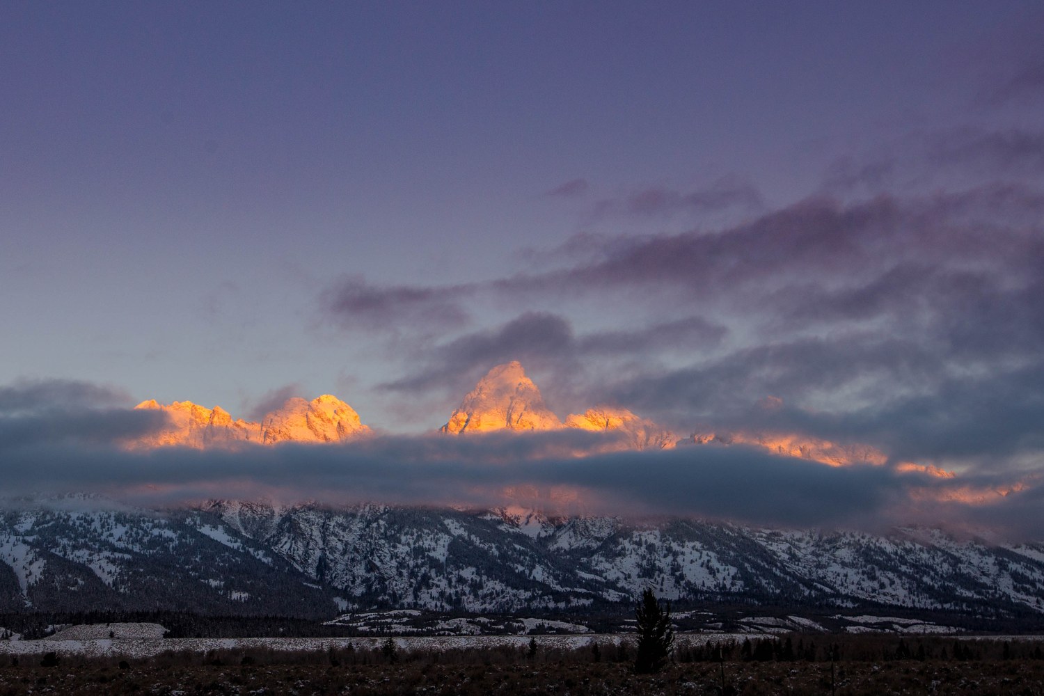 Sunrise from Blacktail Butte over the valley and the range.